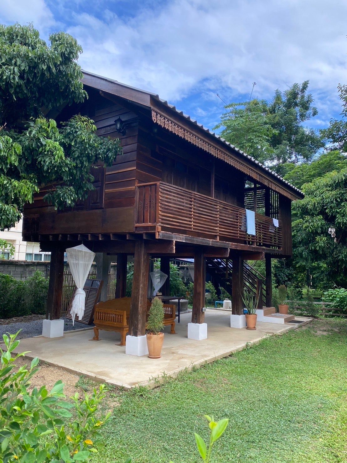 Traditional Thai Lhong Khao style raised house in the garden